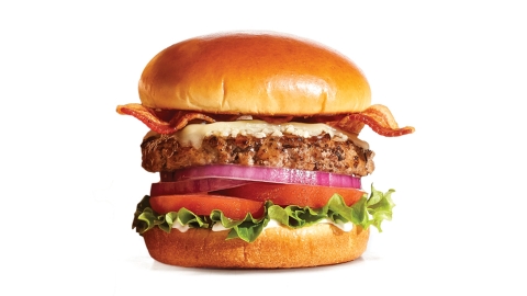 New Garlic Butter Steakburger from IHOP is topped with savory house-made Gilroy garlic butter, custom-cured hickory-smoked bacon, White Cheddar cheese, fresh lettuce, tomato, onion and mayo. (Photo: Business Wire)