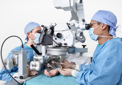 Surgeons using Microsure's MUSA during a microsurgical procedure in a patient's arm. Photo courtesy  ... 