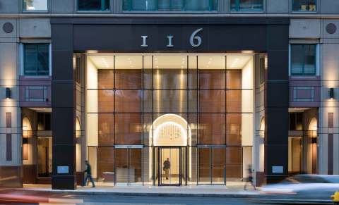 Columbia Property Trust repositioned 116 Huntington Avenue in Boston with a reimagined main entrance and lobby, updated elevators and other common areas, and connection between the two top floors and outside rooftop terraces. Photo by Chuck Choi Architectural Photography.