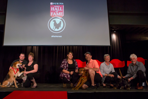 Jason Chafe and Rachel Spiewak with Tucker, Brittany and Bryan Ouellette with Rosco and Louise Robillard and Andy Chyc with Shelby, accepting their medals of honour at the 51st Purina Animal Hall of Fame ceremony. (Photo: Business Wire)