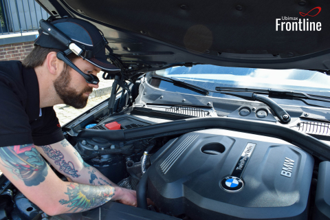 BMW mechanic using Ubimax software wearing the RealWear HMT-1 hands-free wearable computer to speed repairs by up to 75%. (Photo: Business Wire)