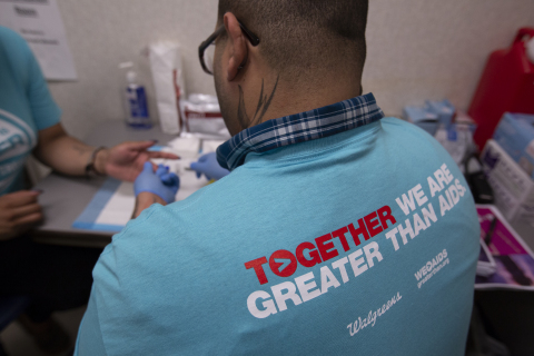Member of a local testing organization performing an on-site free and fast HIV test (Photo: Business Wire)