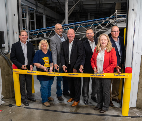 Lamb Weston employees closed the ceremony with a ribbon cutting.  Shown left to right: Rick Martin, Chief Supply Chain Officer; Leslie Winker, 45 year tenured employee; Neal Flyg, Hermiston Plant Manager; Tom Werner, President & CEO; Wayne Claver, Senior Director of Manufacturing; Carol Samoray, Vertical Stand-up Manager; and Brian Jackson, Engineering Manager. (Photo: Lamb Weston)