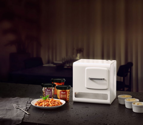 Introducing Genie, the world's only compact, automated cooking system in a small footprint (that is the size of a home coffee machine) that can cook delicious and nutritious meals with the push of a button. Serving Traditional Penne Bolognese. (Photo: Business Wire)