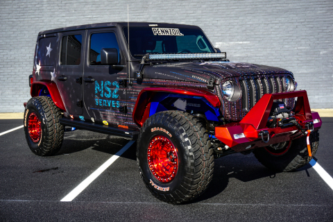 This Jeep was custom designed by Tommy Pike Customs in partnership with ARIES and features a 3.6-liter V6 engine, and 8-speed automatic transmission, and a full military-themed vehicle vinyl wrap with graphics and more. 100% of the hammer price of this jeep will benefit NS2 Serves, a non-profit that prepares veterans for jobs in high-tech. Bid on this vehicle and others at www.proxibid.com/barrettjackson (Photo: Barrett-Jackson).