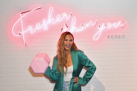 Chrissy Teigen poses at the FOREO booth at the POPSUGAR Play/Ground. (Photo: Angela Weiss)