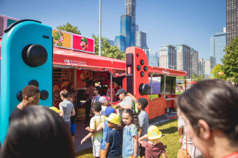 In this photo provided by Nintendo of America, members of the Chicago Children’s Museum kick off the nationwide Nintendo Switch Road Trip at Navy Pier in Chicago on June 27, 2019. The event allowed attendees to play a variety of Nintendo Switch games, including the Super Mario Maker 2 game a day before its June 28 launch. Super Mario Maker 2 gives players the tools to play, create and share side-scrolling Super Mario courses. The tour continues across the country through mid-October. (Photo: Business Wire)