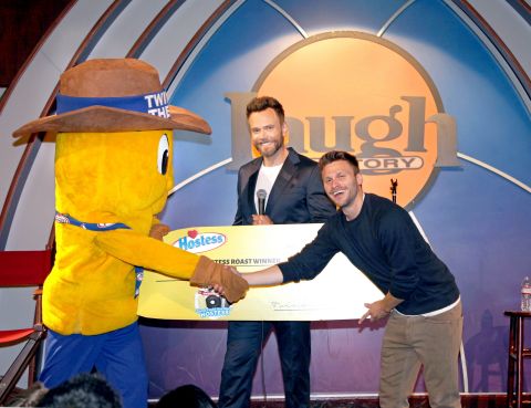 Hostess Roast master of ceremonies Joel McHale and Twinkie the Kid present Jon Rudnitsky with a $10,000 check after he was declared winner of the Hostess Roast. Rudnitsky took the stage along with fellow comedians Erica Rhodes, Johnny Sanchez, Harland Williams, Finesse Mitchell and Mary Lynn in front of an audience of fans who gathered at the Laugh Factory on June 25th.