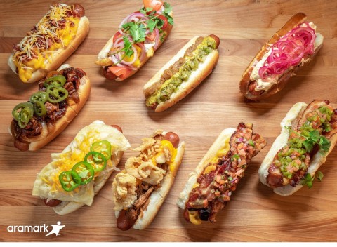Aramark, the award winning food and hospitality partner of nine Major League Baseball teams, is celebrating National Hot Dog Day, July 17, 2019, with a decadent selection of a dozen loaded hot dogs, sausages and vegan dogs at the ballparks it serves. (Photo: Business Wire)