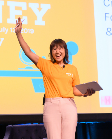 VIPKid Founder and CEO Cindy Mi waves to the audience of 500 online English teachers. Photo Credit: VIPKid/Grant Miller Photography