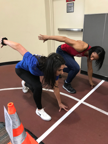 Sylvia Hoffman, 2018 finalist, The Next Olympic Hopeful, and now a member of Team USA Bobsled, demonstrates the sprint position to an athlete during recent 24 Hour Fitness in-club tryouts (Photo: Business Wire)