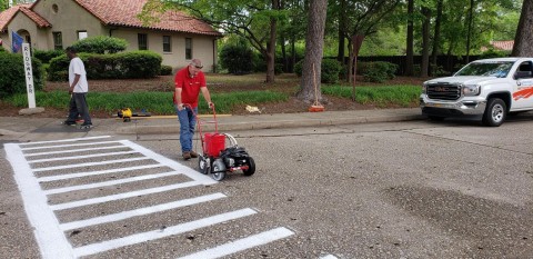 The Fort Bragg housing partnership with Corvias and the U.S. Army includes community care, such as crosswalk striping, paving, and cleaning. (Photo: Business Wire)