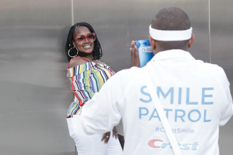 A Cincinnati Music Festival attendee smiles with confidence, as the Crest Smile Patrol takes Polaroid photos of guests all weekend long. (Photo: Business Wire)