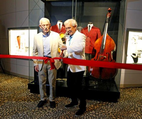 Tom and Dick Smothers cut the ribbon on the new Smothers Brothers exhibit at The National Comedy Center in Jamestown, N.Y. on July 29, 2019. (Photo: Business Wire)