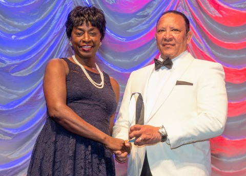 Rynthia Rost accepts the Charles B. Collins Distinguished Trustee Award from National Urban League President and CEO Marc H. Morial. Photo courtesy of the National Urban League (Photo: Business Wire)