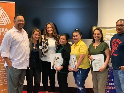 Michelle Marquez (3rd from left) with participants from Financial Literacy workshop (Photo: Business Wire)