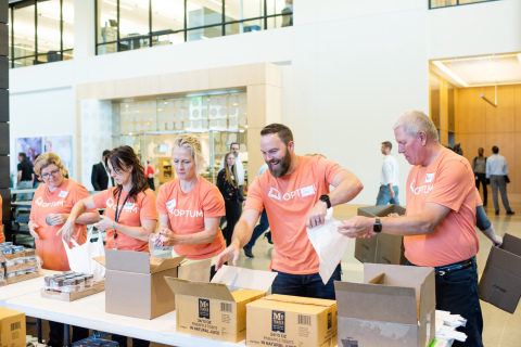 Nearly 500 Optum employee volunteers in Eden Prairie, Minn., teamed up with The Sheridan Story, a local nonprofit committed to fighting child hunger, to prepare meals and backpacks as part of Optum’s second-annual global giving day. The elaborate operation used conveyer belts and trucks to load and deliver 40,000 backpacks full of healthy food – the equivalent of 150,000 meals – to children in need (Photo: Dean Riggott).