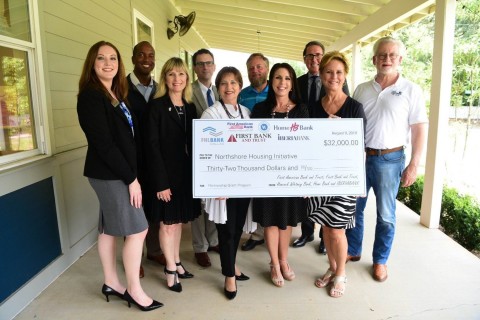 Affordable housing nonprofit, Northshore Housing Initiative, joined officials on Friday from the Federal Home Loan Bank of Dallas, Home Bank, Hancock Bank, First American Bank and Trust, First Bank and Trust and IBERIABANK for a check presentation, recognizing the $32,000 in Partnership Grant Program (PGP) funds collectively donated by the banks. (Photo: Business Wire)