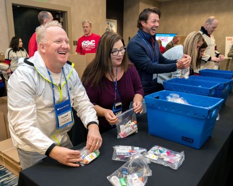 Team Schein Members begin assembling “comfort kits” for people fighting cancer as part of Henry Schein, Inc.’s second annual We Care Global Challenge. (Photo: Business Wire)