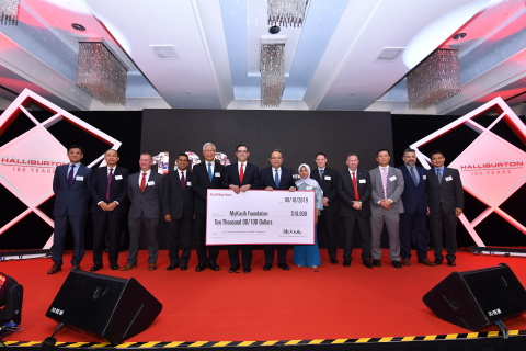 Halliburton Chairman, President and CEO Jeff Miller, joined by Halliburton Asia Pacific Region management, present a $10,000 grant to the MyKasih Foundation for their work to help low-income Malaysian families through food distribution and education. (Photo: Business Wire)
