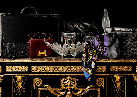 Among the vintage luxury goods featured at Abell Auction Co.’s Sept. 10 live and online sale are (left to right) this Louis Vuitton Alzer 55 noir hard suitcase, Chanel black quilted east west flap bag, Lalique molded glass jardinière, Versace Versus safety pin bag, Hermes Pierres d'Orient et d'Occident scarf, Gucci by Tom Ford Serpent messenger bag, Lalique penguin and Valentino Garavani black Demetra handbag. (Photo: Business Wire)
