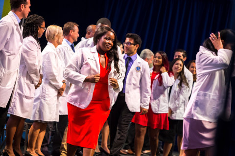 Ross University School of Medicine Students receiving their white coats. (Photo: Business Wire)