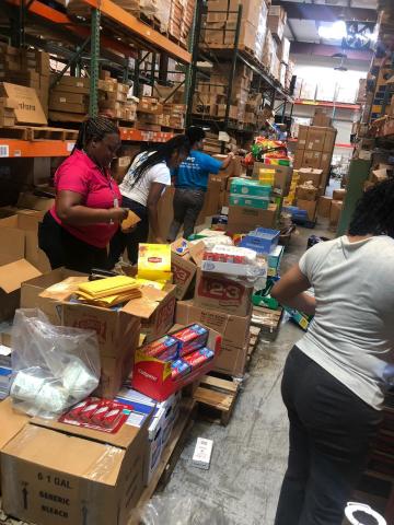 BTC employees preparing supplies for evacuees (Photo: Business Wire)