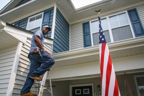 A Corvias team member tends to on-base housing. Earlier this year, the company launched The Corvias Commitment and data released today confirms significant improvement seen across the military housing portfolio. (Photo: Business Wire)