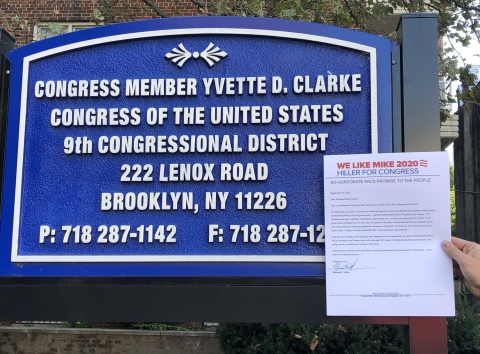 Michael Hiller Campaign Delivering No Corporate PAC Promise to the People to Yvette Clarke's Brooklyn Office. (Photo: Business Wire)