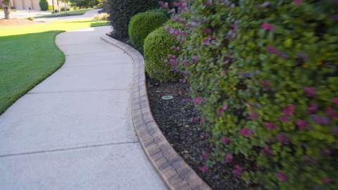 Bricks or pavers are a good options for bed edging, though installation can be more challenging for homeowners due to the masonry skill required for mortaring. (Photo: Exmark)