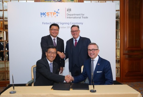 Mr. Albert Wong, Chief Executive Officer of Hong Kong Science and Technology Parks Corporation (1st row, left) and Mr. Paul McComb, Director General, Department for International Trade (1st row, right) signed a Memorandum of Understanding to establish a long-term and strategic relationship, witnessed by Mr. Andrew Heyn OBE, British Consul General to Hong Kong and Macao ( 2nd row, right) and Dr. Sunny Chai, Chairman of Hong Kong Science and Technology Parks Corporation (2nd row, left). (Photo: Business Wire)