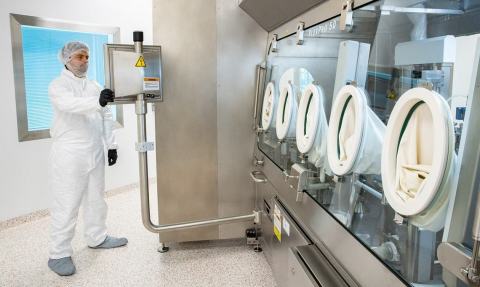 A TriPharm employee in one of the four isolator manufacturing suites. (Photo: Business Wire)