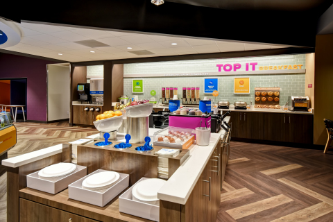 Guests can enjoy Tru by Hilton’s complimentary build-your-own “Top It” hot breakfast bar with healthy, sweet and savory items along with more than 35 toppings. Credit: Tru by Hilton