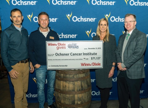 From left to right: Don Noel, President of Port Orleans Brewing Co.; Chip Turner, District Manager at Winn-Dixie; Elizabeth Lapeyre, MD, Director, Integrative Medicine Program for Ochsner; Brian Moore, MD, FACS, Director, Ochsner Cancer Institute (Photo: Business Wire)