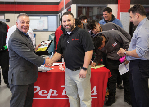 Lincoln Tech’s Mahwah Campus President Robert Paganini presents the Chief Executive Officer and President’s Pride in Partnership Award to Pep Boys Service Area Director Vinny Lemmo. (Photo: Business Wire)