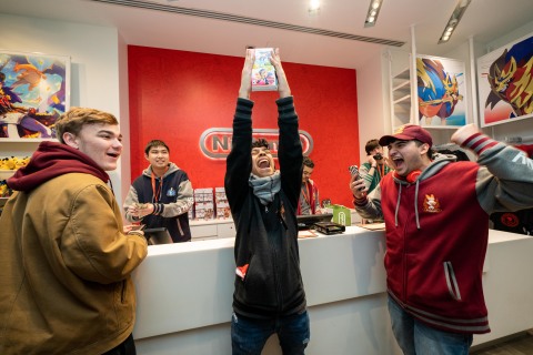 In this photo provided by Nintendo of America, the first few fans to make an in-store purchase of the Pokémon Sword and Pokémon Shield games celebrate at the Nintendo NY store on Nov. 15, 2019. (Photo: Business Wire)