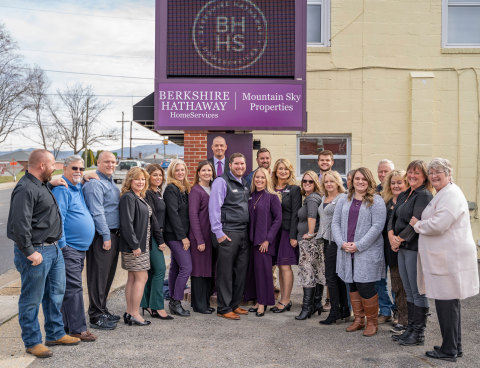 The Berkshire Hathaway HomeServices Mountain Sky Properties team gathers outside its headquarters. (Photo: Business Wire)