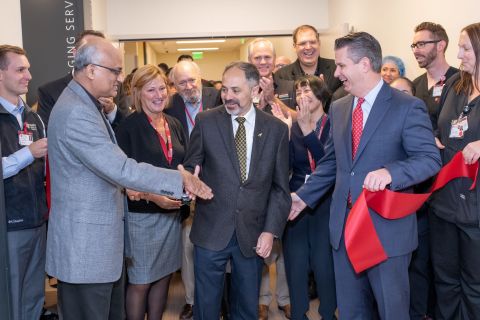 Sridhar Seshadri, Chief Administrative Officer, Destination Service Lines, joins Judith Wood, Administrative Director of Imaging Services, Sam Gambhir, Chair of Radiology, and David Entwistle, President and CEO of Stanford Health Care and members of the Radiology team in cutting the ribbon on the Radiology Department at the new Stanford Hospital. Steve Fisch Photography.