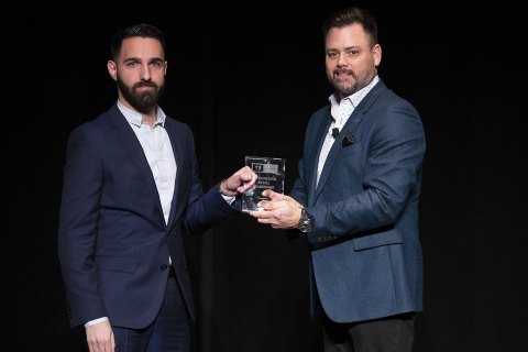 John Hairabedian, president of HGreg.com (left), receives from Keith Crerar, vice president, global operations at TradeRev, the Auto Group of the Year Award in Las Vegas, Nov. 12, 2019. (Photo: Business Wire)