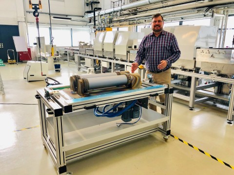 AE Showcase Lab director, Dr. Robert Andosca, stands next to dual magnetron sputtering cathodes with 600 mm long silicon targets for inline glass coater system in background. (Photo: Business Wire)