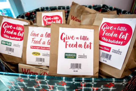 Now through Dec. 24, BI-LO, Fresco y Más, Harveys Supermarket and Winn-Dixie customers can join in the spirit of giving by purchasing a $5 prepared bag of non-perishable food items or by rounding up grocery totals at store registers to spread holiday cheer to local families in need. (Photo: Business Wire)