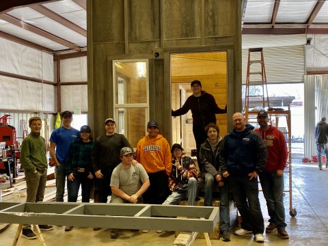Brett Joerger, CEO of Westhaven Inc. with 4G Foundation and local students, building a Tiny House for Camp Fire survivor, Chris Brackett. (Photo: Business Wire)
