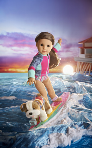 Surfer Joss Kendrick, American Girl's 2020 Girl of the Year, riding the waves with her bulldog, Murph. (Photo: Business Wire)
