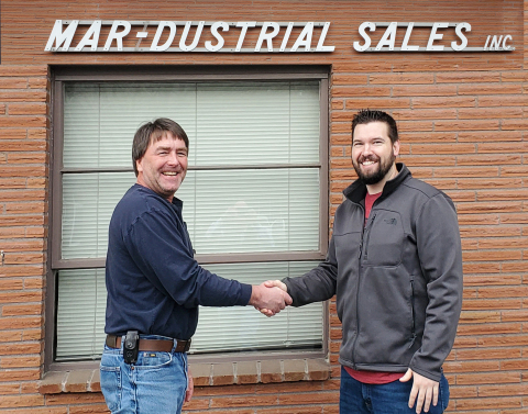 Drew Hansen (left), general manager of Mar-Dustrial Sales, and Joshua Hopkins, president of In Stock Parts, seal the deal. (Photo: Business Wire)