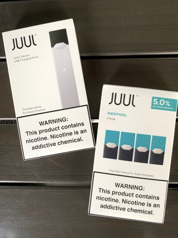 A JUUL device and menthol flavor. (Photo: Business Wire)