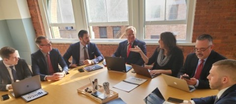 Dave Cantin and his team meet with dealer principals to finalize the terms of a deal. (Photo: Business Wire)