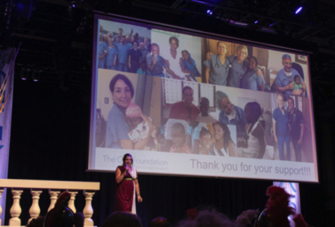 During the 2019 “Gladiators and Goddesses” themed gala held at The Fillmore in Philadelphia, The C14 Foundation founder, Martina Molsbergen Tamaro, presents an overview of the Foundation’s goals and shares photos from the charity efforts it supports, including medical missions to Haiti and other work focusing on developing and applying sustainable solutions to unmet basic needs around the world. (Photo: Business Wire)