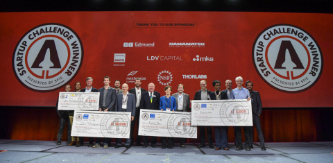 PITCH PERFECT FOUNDERS: Odin Technologies’ Steven Hansen, 4th from left, Eysz’ Rachel Kuperman, 7th from right, and Rubitection’s Sanna Gaspard, 4th from right, display their winning checks with team members, sponsors, judges, and SPIE President John Greivenkamp, center. (Photo: Business Wire)