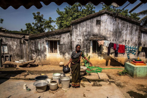 original Mrs. Gurujalli Tejavathi outside her home in the Bhadradri District in India. Mrs. Tejavathi receives free eye care for a previously transplanted cornea from the Tej Kohli Foundation. (Photo: Business Wire)