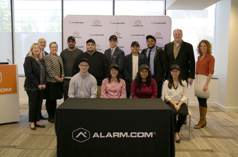 Representatives of Alarm.com, the Office of Governor Northam, Northern Virginia Community College and Fairfax County Economic Development Authority stand with the first apprentices to join the new Alarm.com Apprenticeship program. (Photo: Business Wire)